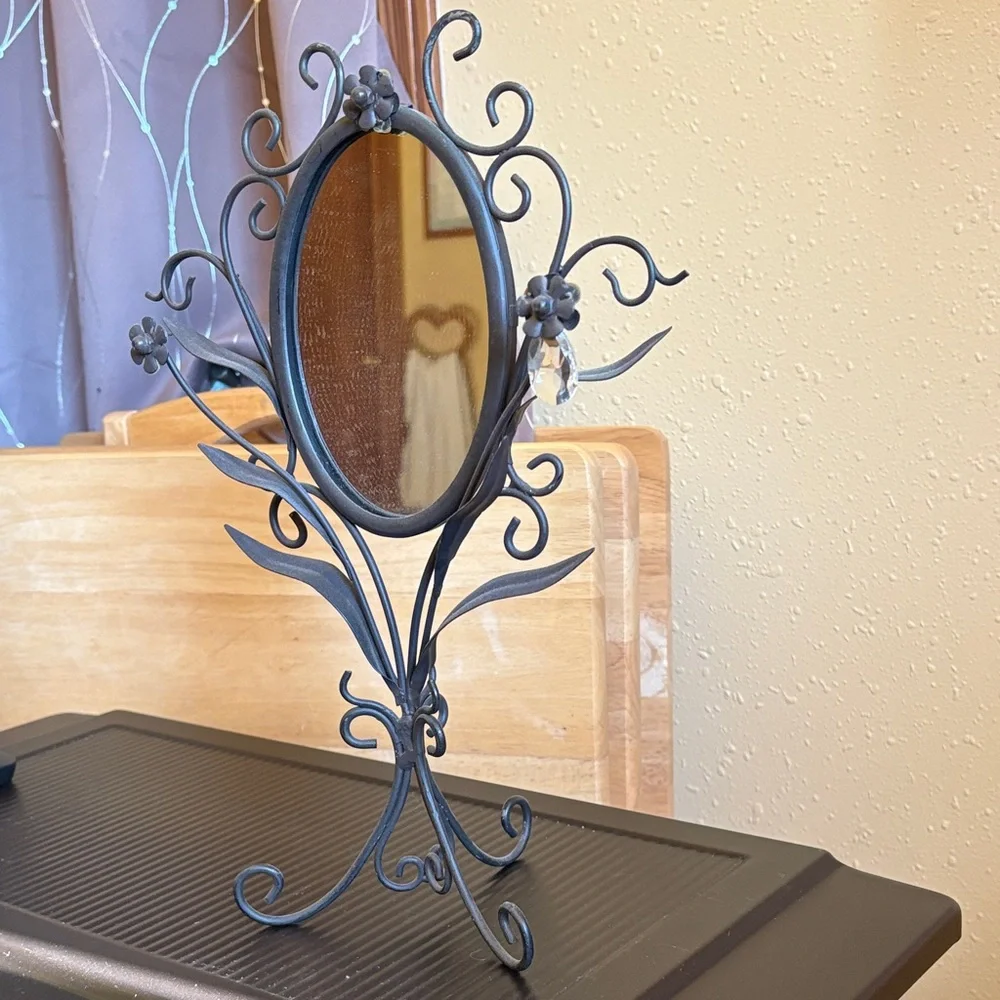 Elegant Black Wall Mirror with Floral Accents